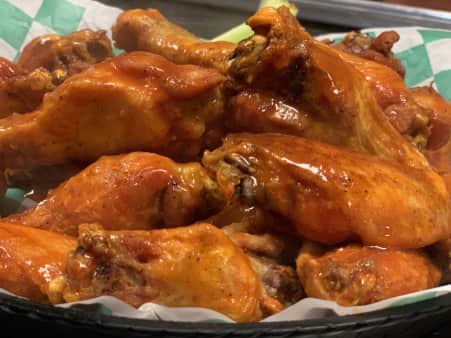 Twenty smoked wings on a tray at The 303 Sports Grill